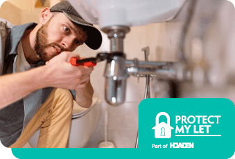 A plumber working on a sink with different tools