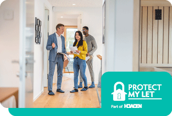 A couple looking around a property with an estate agent